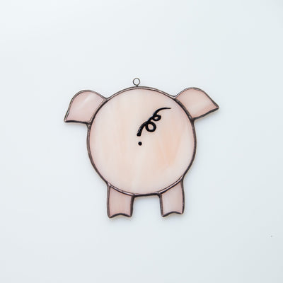 Window hanging of a stained glass pig back-view