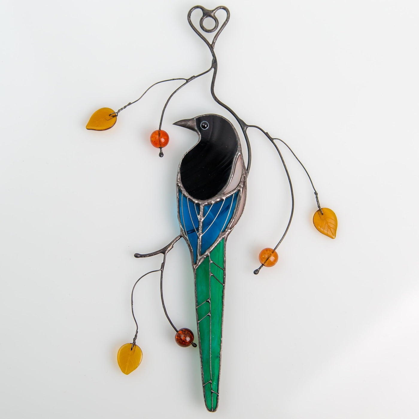 Back view stained glass magpie son the branch suncatcher