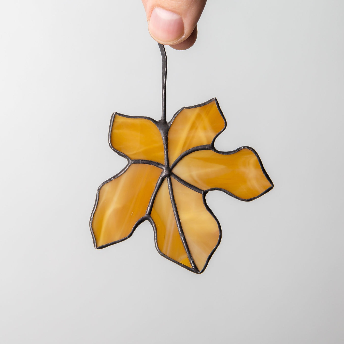Brown stained glass maple leaf suncatcher