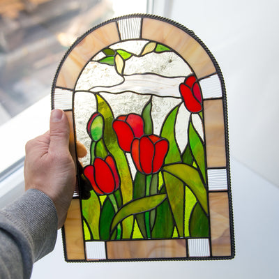 Stained glass panel depicting red tulips