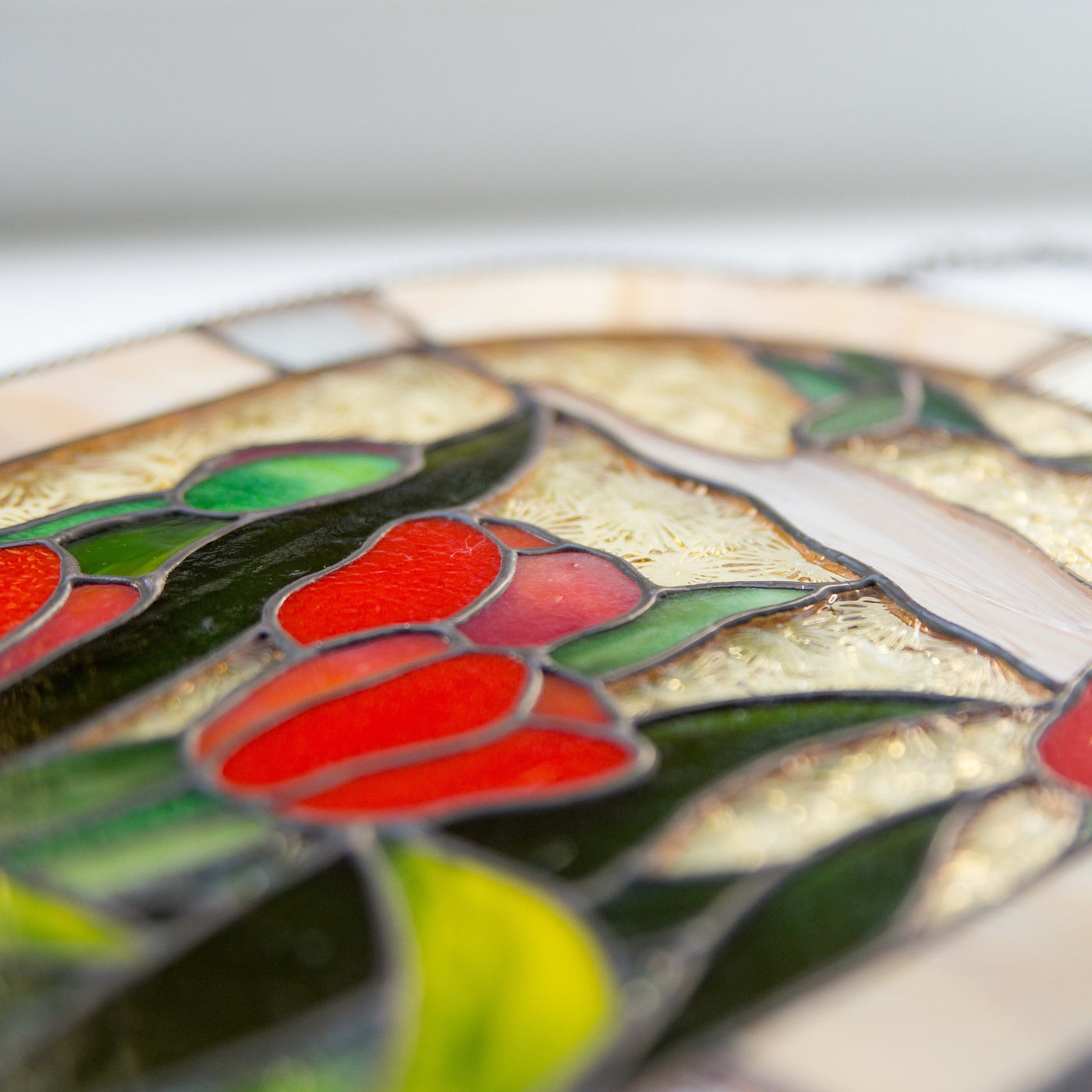 Zoomed stained glass red tulips panel