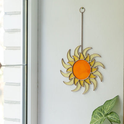 Stained glass shining sun as a wall hanging