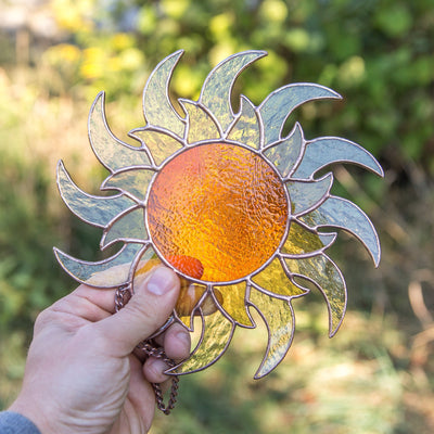 Stained glass window hanging of a shining sun for home decor
