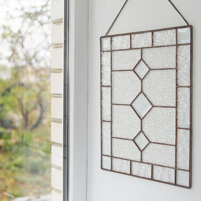 Stained glass panel with beveled inserts as a wall hanging