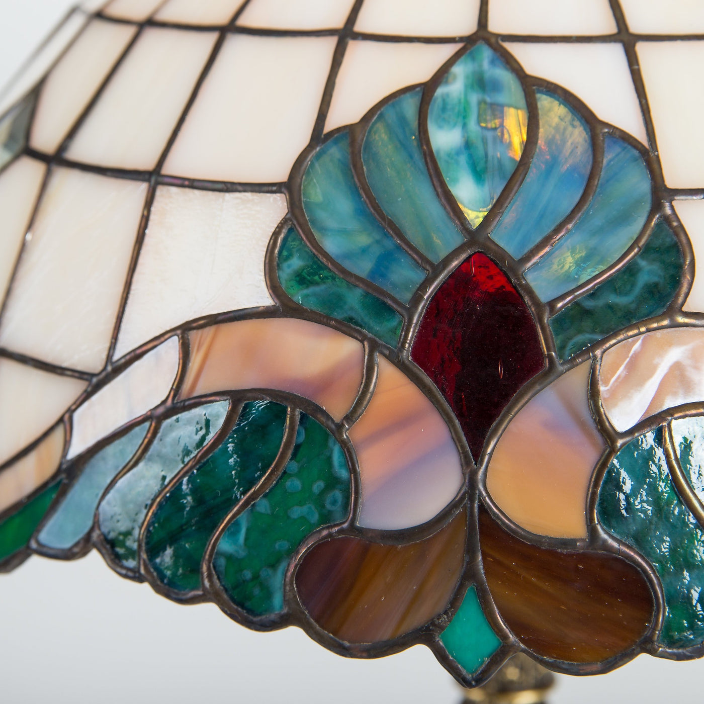 Zoomed stained glass bedside Tiffany lamp with green, red and brown inserts 