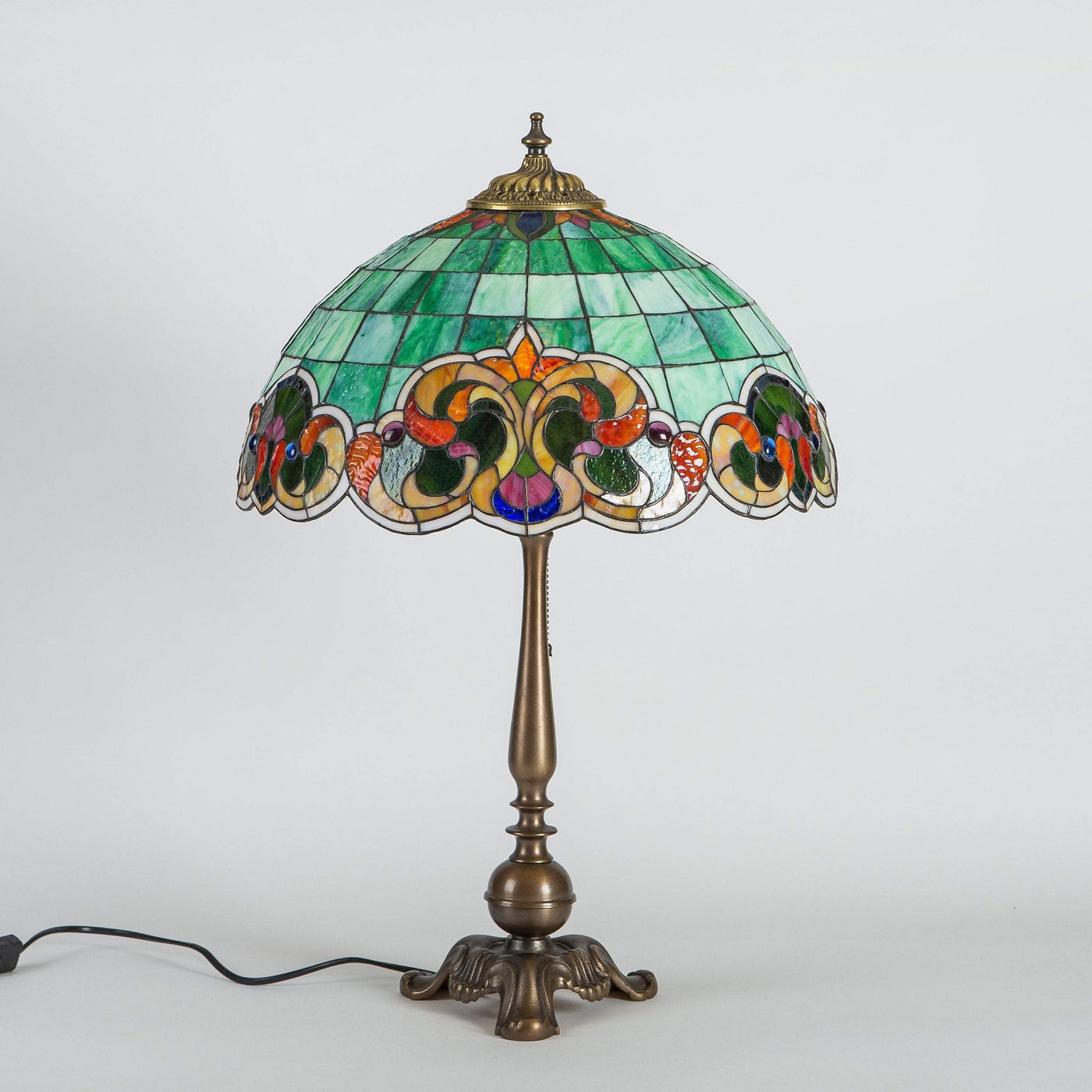 Stained glass green lamp in Tiffany style with colourful markings