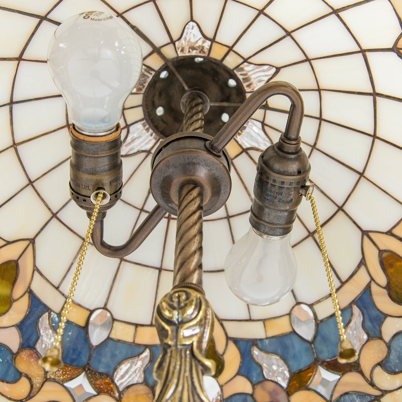 The inner view of stained glass Tiffany lamp of beige shades