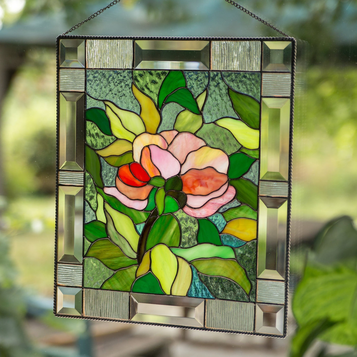 Stained glass panel depicting peony flower with leaves on the background