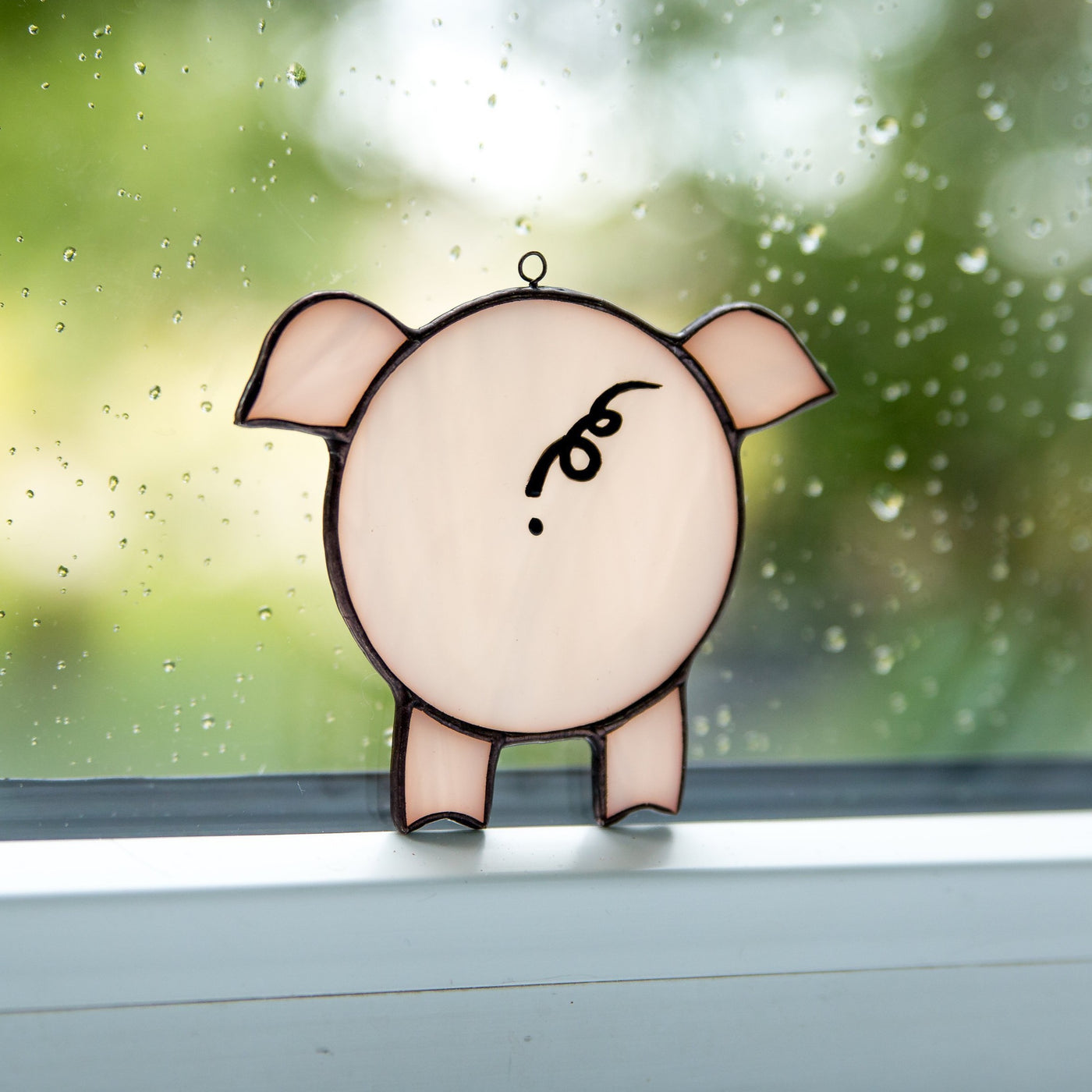 Stained glass looking through the window pig suncatcher