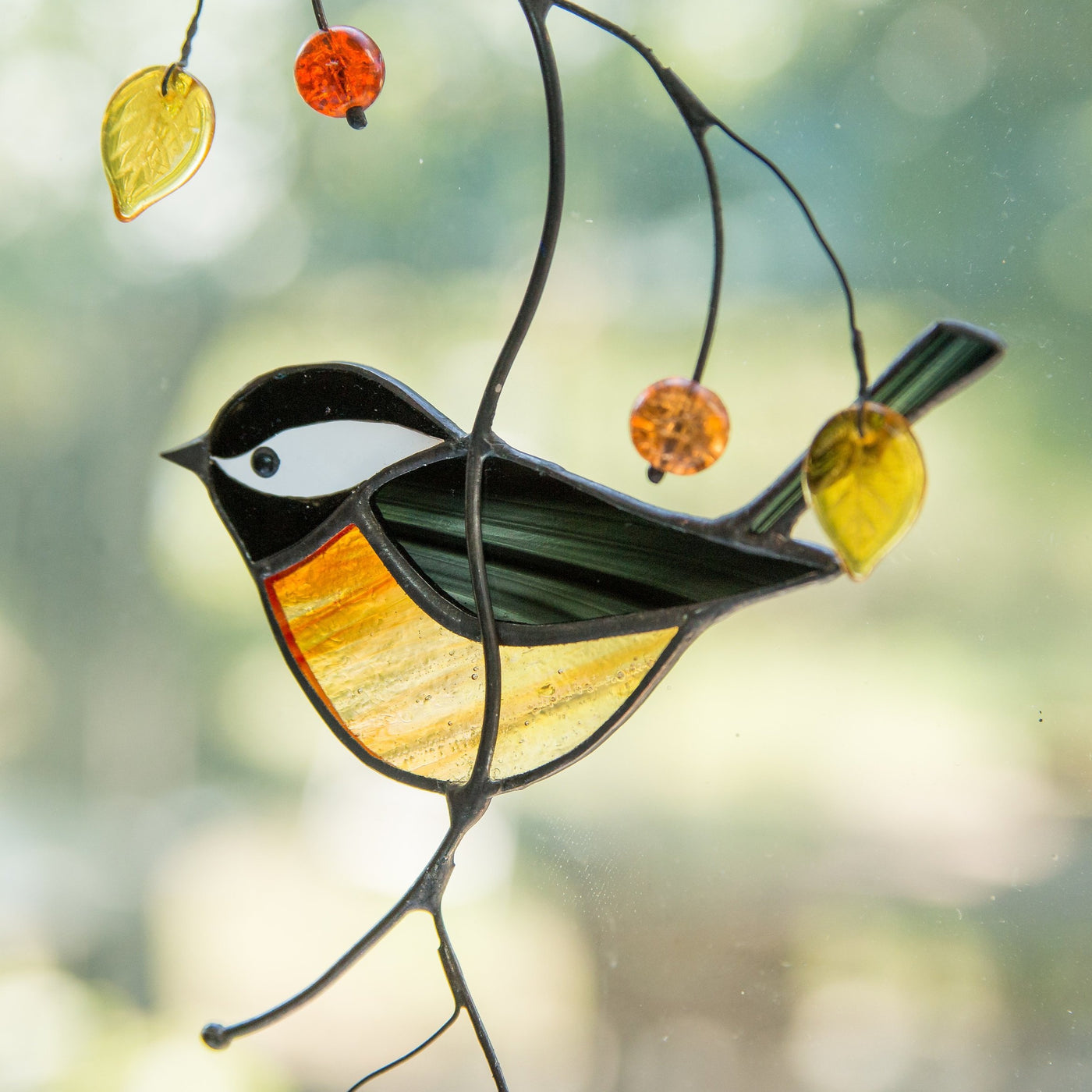 Zoomed stained glass black chickadee window hanging