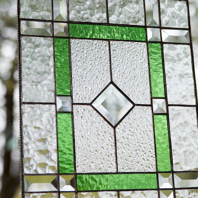 Zoomed stained glass panel with green and beveled inserts for window decoration 