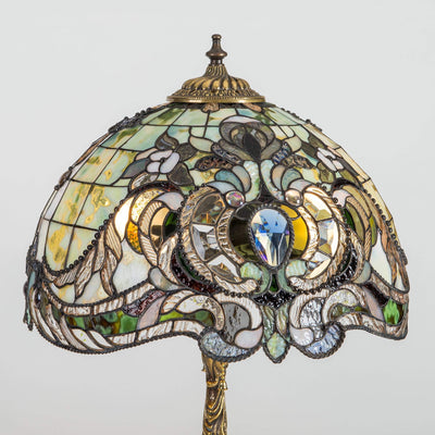 Zoomed stained glass green Tiffany lampshade with blue beveled inserts and variety of markings