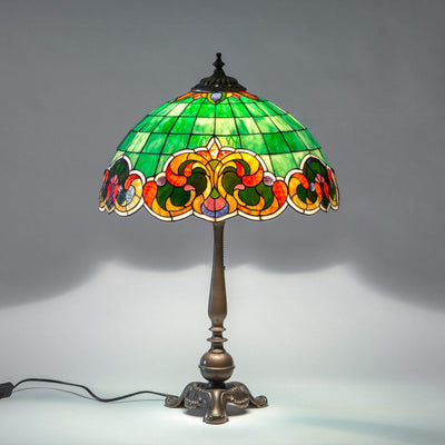 Green Tiffany stained glass lampshade with orange and red markings