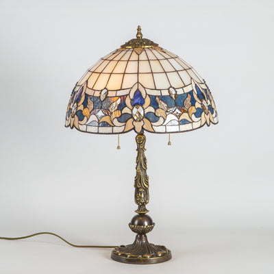 Stained glass art nouveau Tiffany lamp of beige colours with blue inserts 