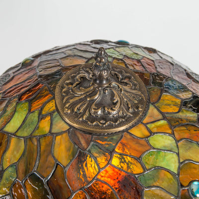 The engraving on top of stained glass dragonfly lamp