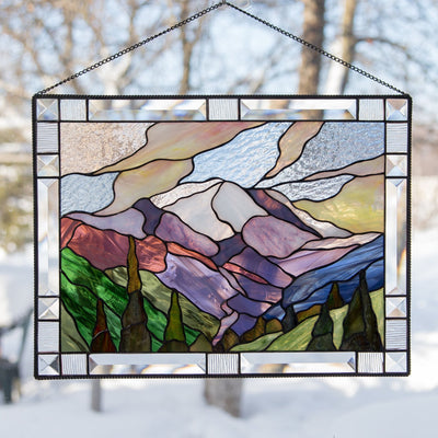 Stained glass window hanging of Mount Rainier National park with its adjacent forest