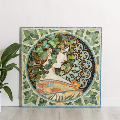 Mosaic of stained glass depicting woman in ivy leaves based on Alphons Mucha's pattern