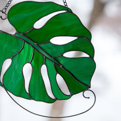 Zoomed stained glass monstera leaf suncatcher