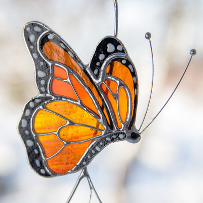 Zoomed stained glass side-view monarch butterfly suncatcher