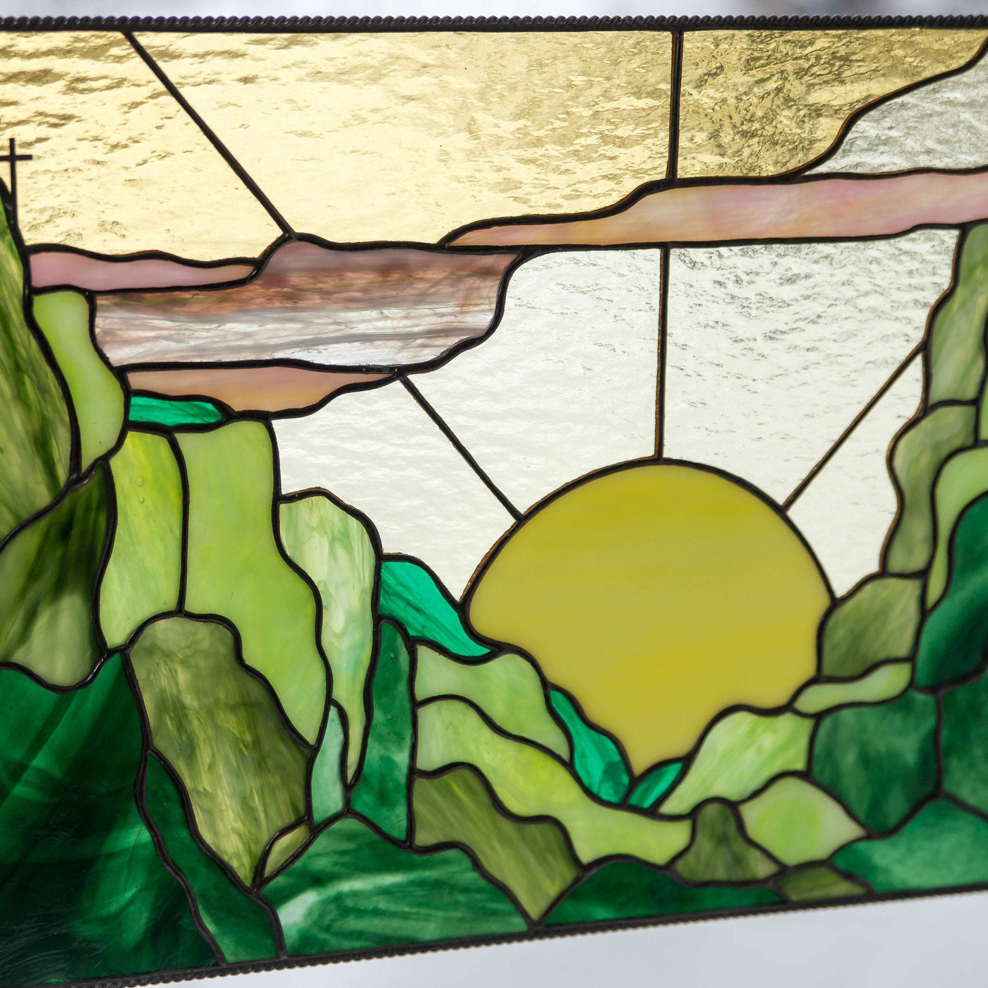 Zoomed stained glass sunset window hanging