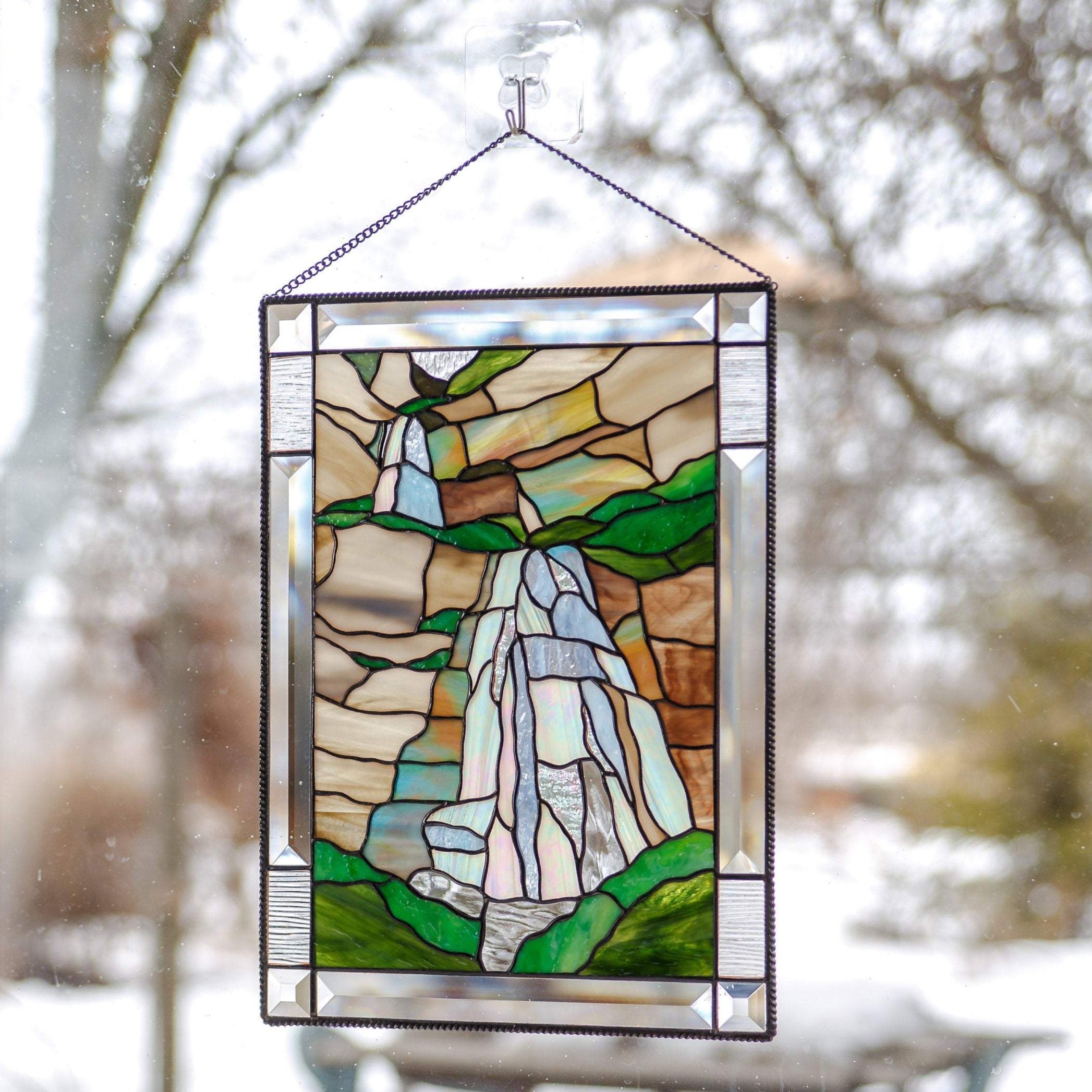 Panel of stained glass depicting Bridal Veil Waterfalls in Utah