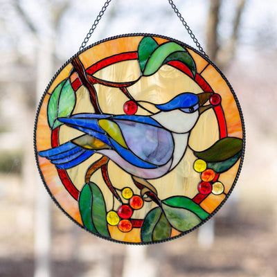Blue jay with berry in its pecker stained glass round panel for window