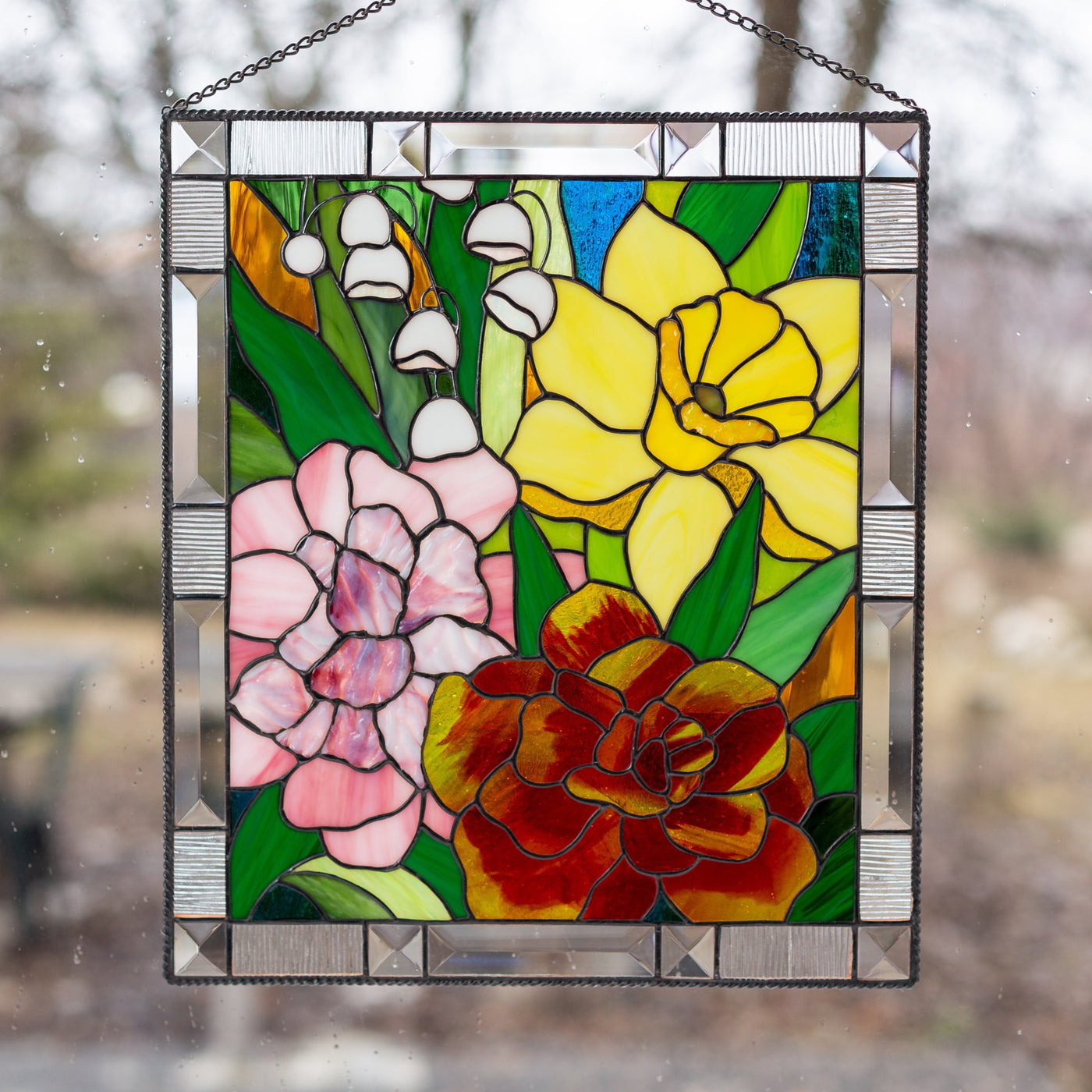 Stained glass panel depicting Marigold, Daffodil, Carnation and Lily for window decoration
