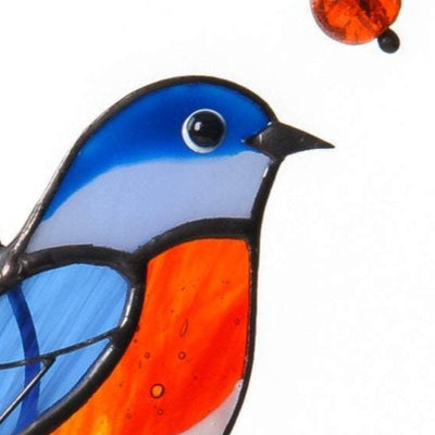 Zoomed stained glass orange-breasted bluebird window hanging
