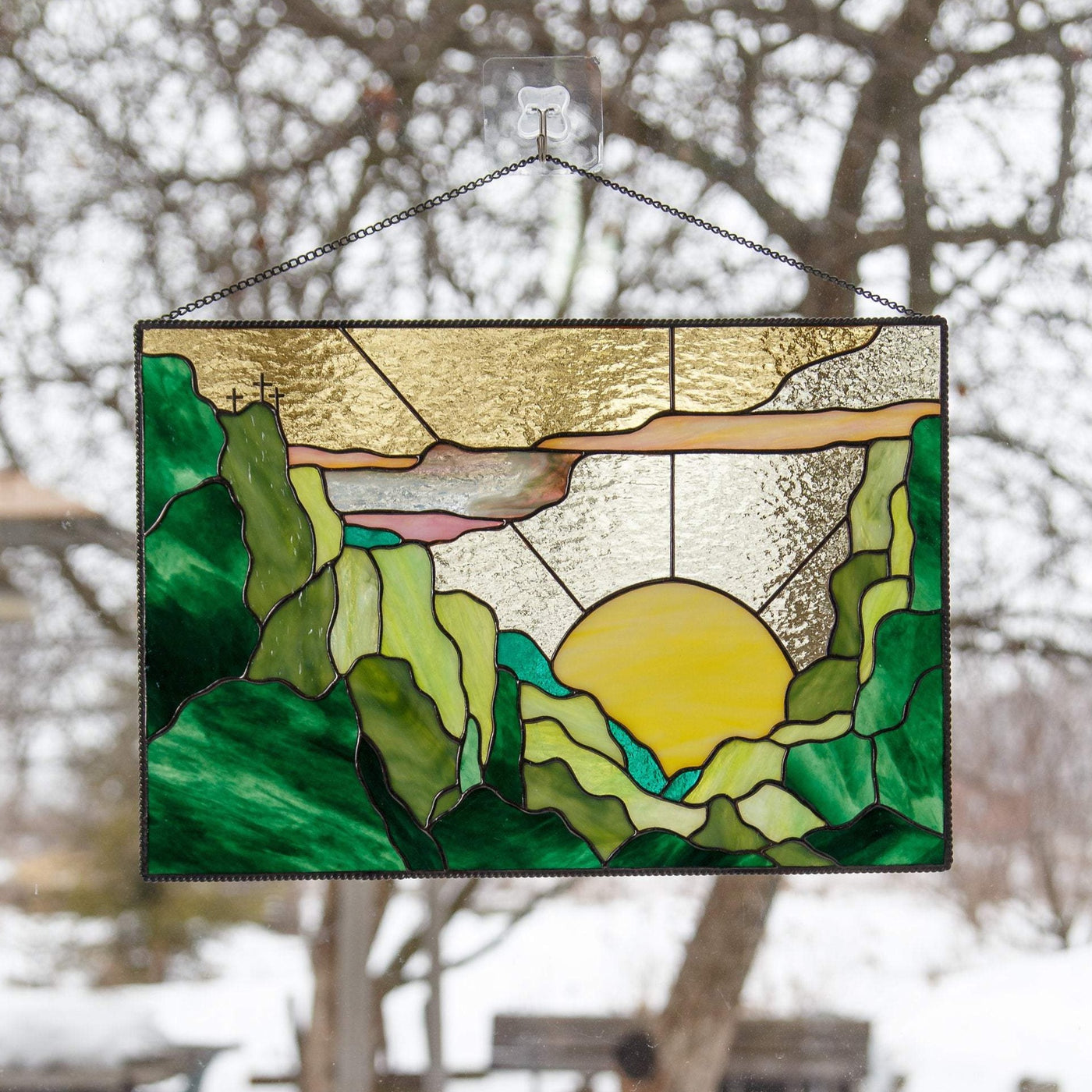 Window hanging of stained glass depicting sunset