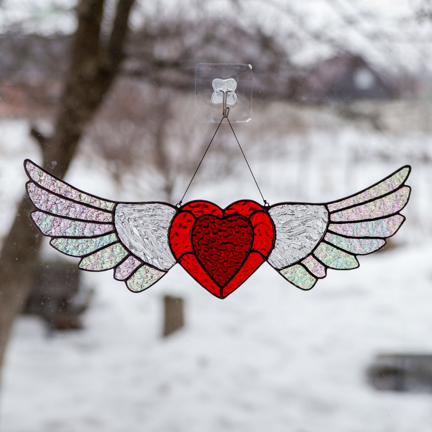 Stained glass heart with iridescent wings suncatcher