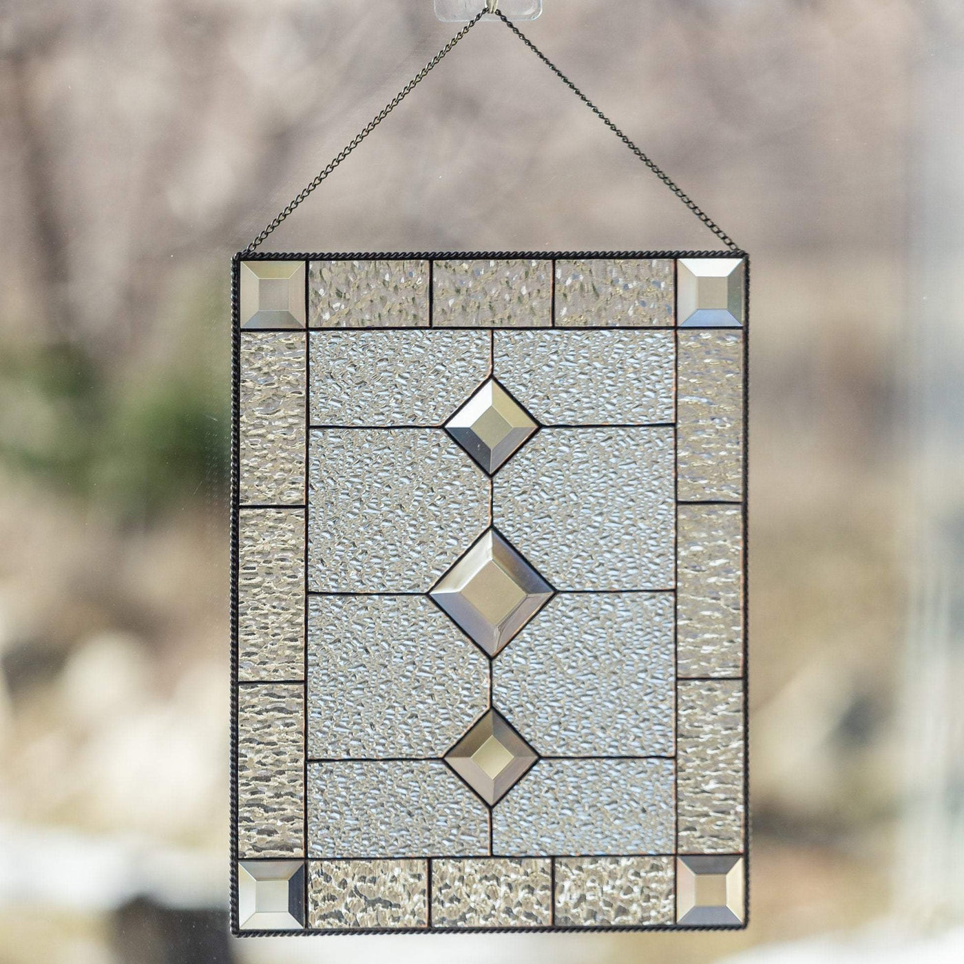 Clear stained glass window panel with beveled inserts