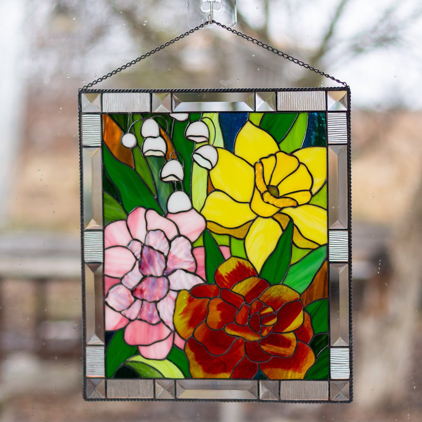 Marigold, daffodil, carnation and lily panel of stained glass