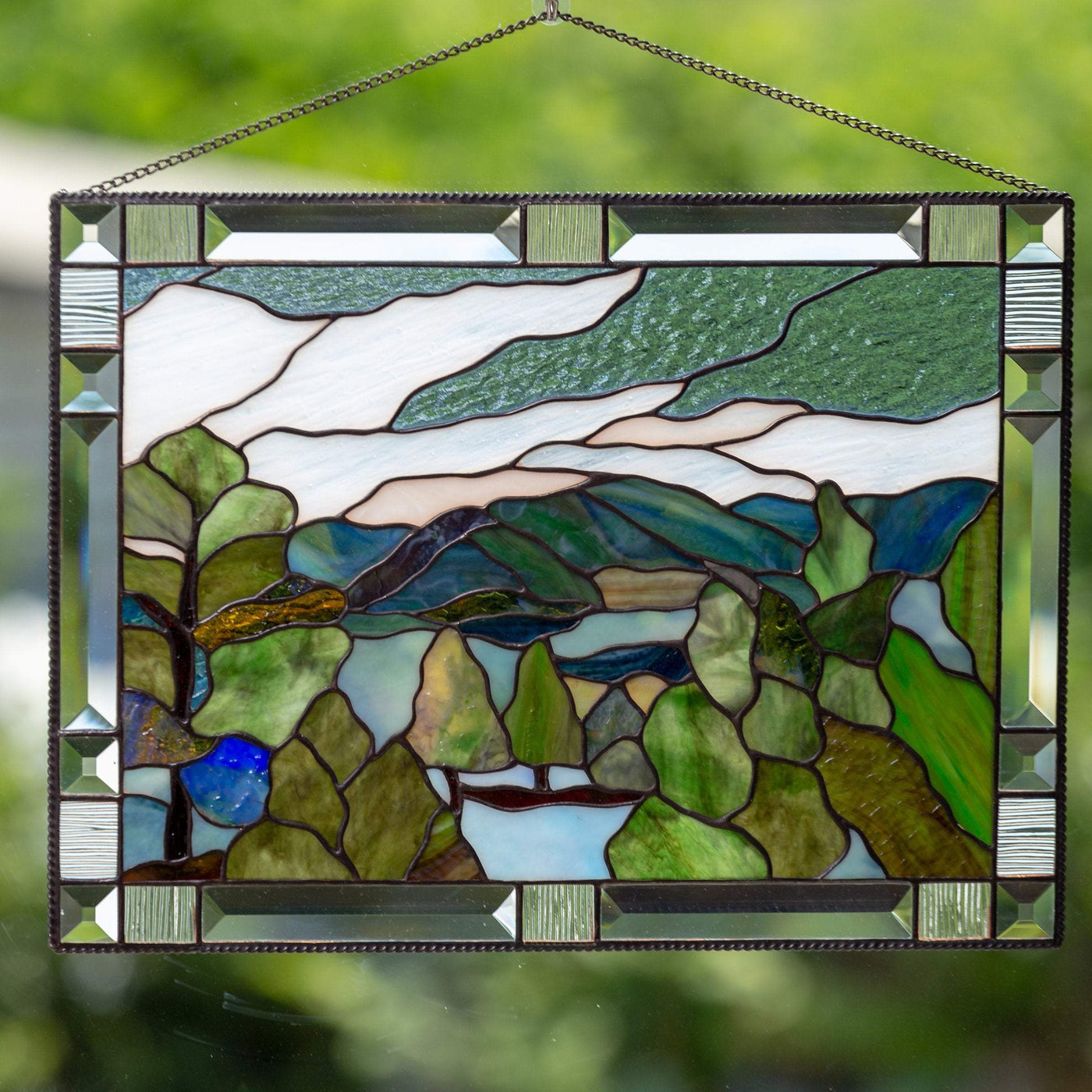 Stained glass panel depicting Estes Park with its flora and mountains