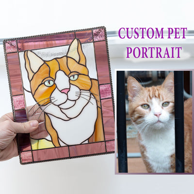 Red cat portrait in a pink frame panel of stained glass