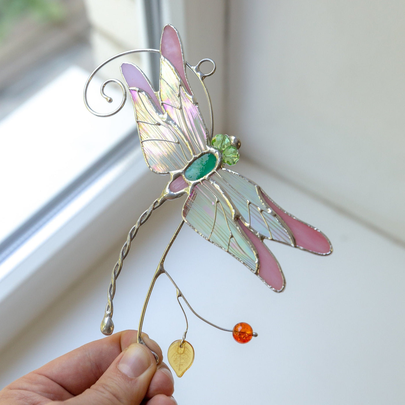 Stained glass pink dragonfly with iridescent wings suncatcher
