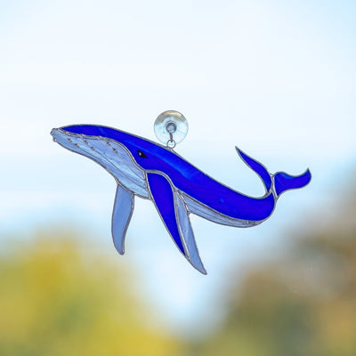 Royal blue stained glass whale with sky-blue lower part suncatcher for window