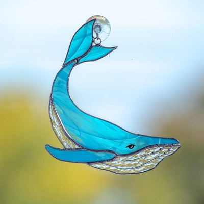 Stained glass light blue whale with clear lower part window hanging