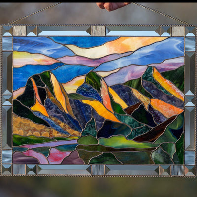 Three Sisters Mountains panel of stained glass