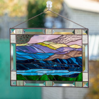 Panel of stained glass depicting mount Washington