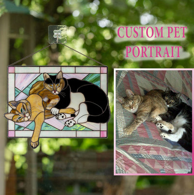 Stained glass rectangular portrait of 2 cats lying together
