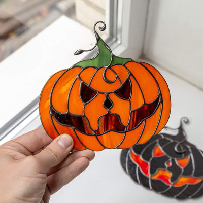 Halloween stained glass pumpkin with creepy face