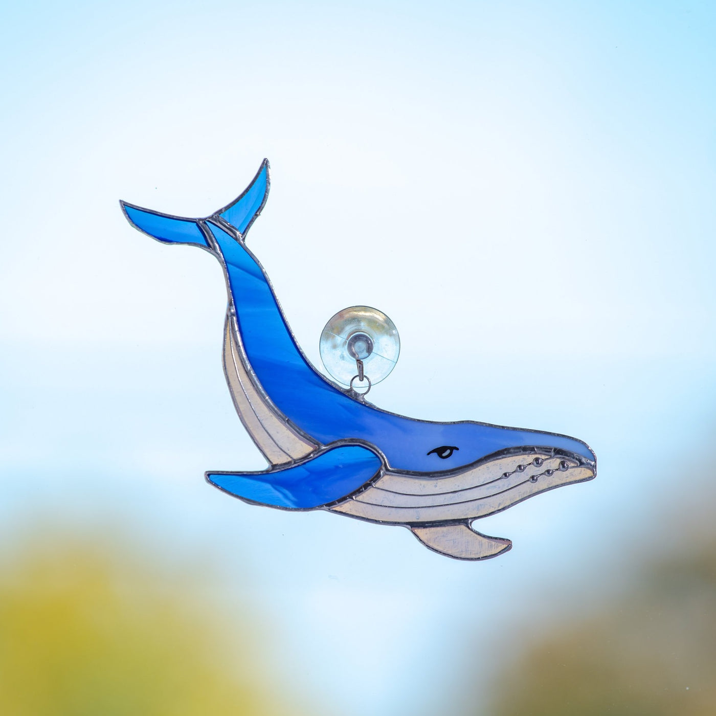 Stained glass royal blue whale with clear lower part window hanging