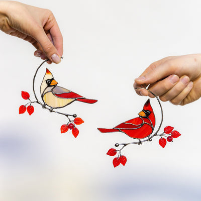 Stained glass suncatcher of male and female cardinals