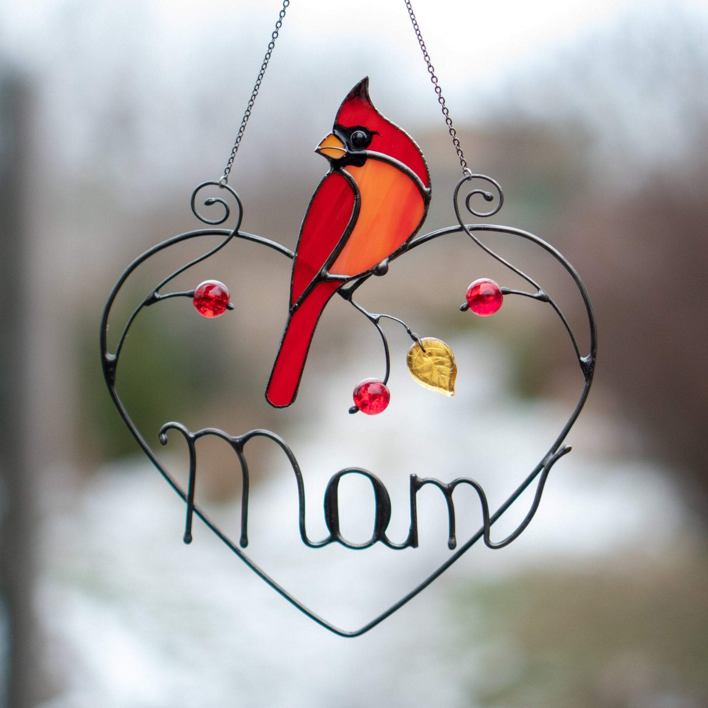 Stained glass redbird sitting on a wire heart with personalization suncatcher