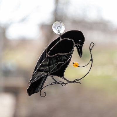 Stained glass raven on the branch suncatcher for window decoration