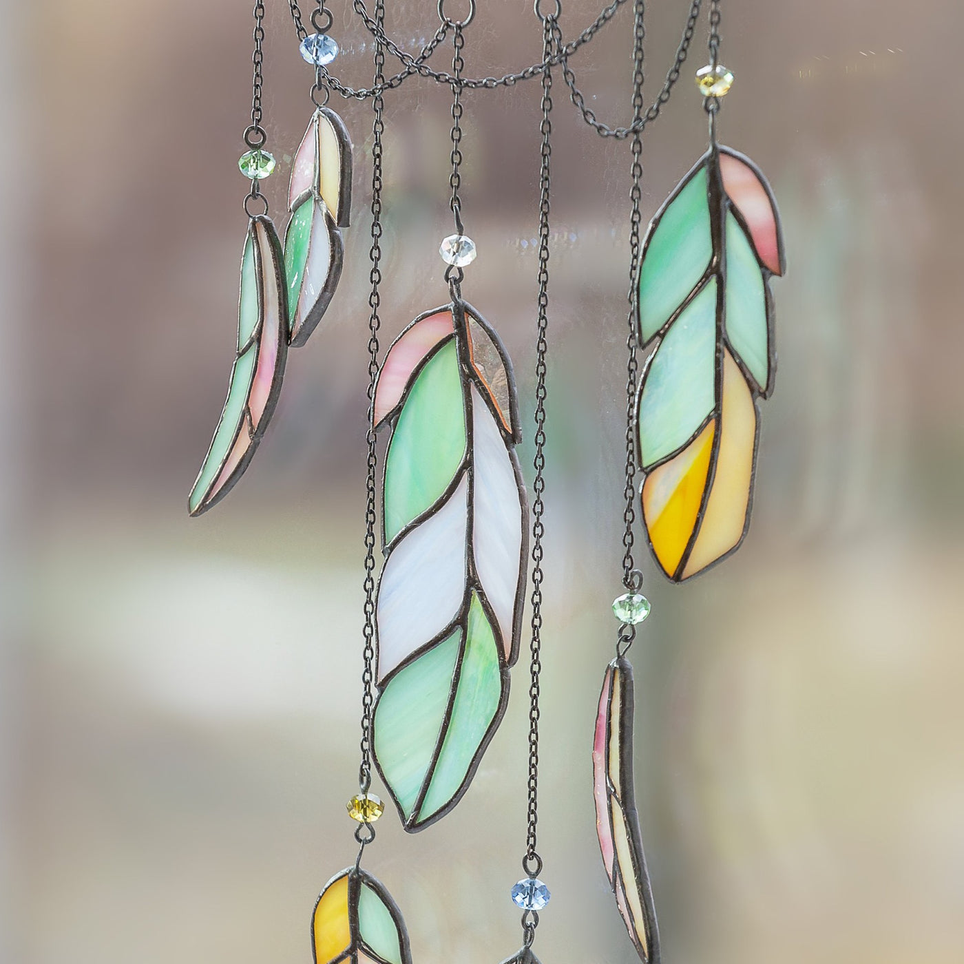 Zoomed stained glass feathers of dreamcatcher