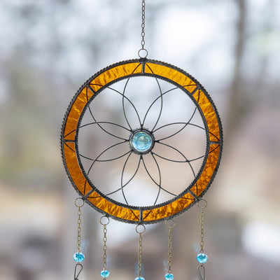 Zoomed upper part of a stained glass dreamcatcher 