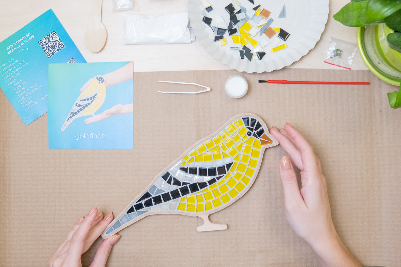 The process of creating goldfinch glass mosaic