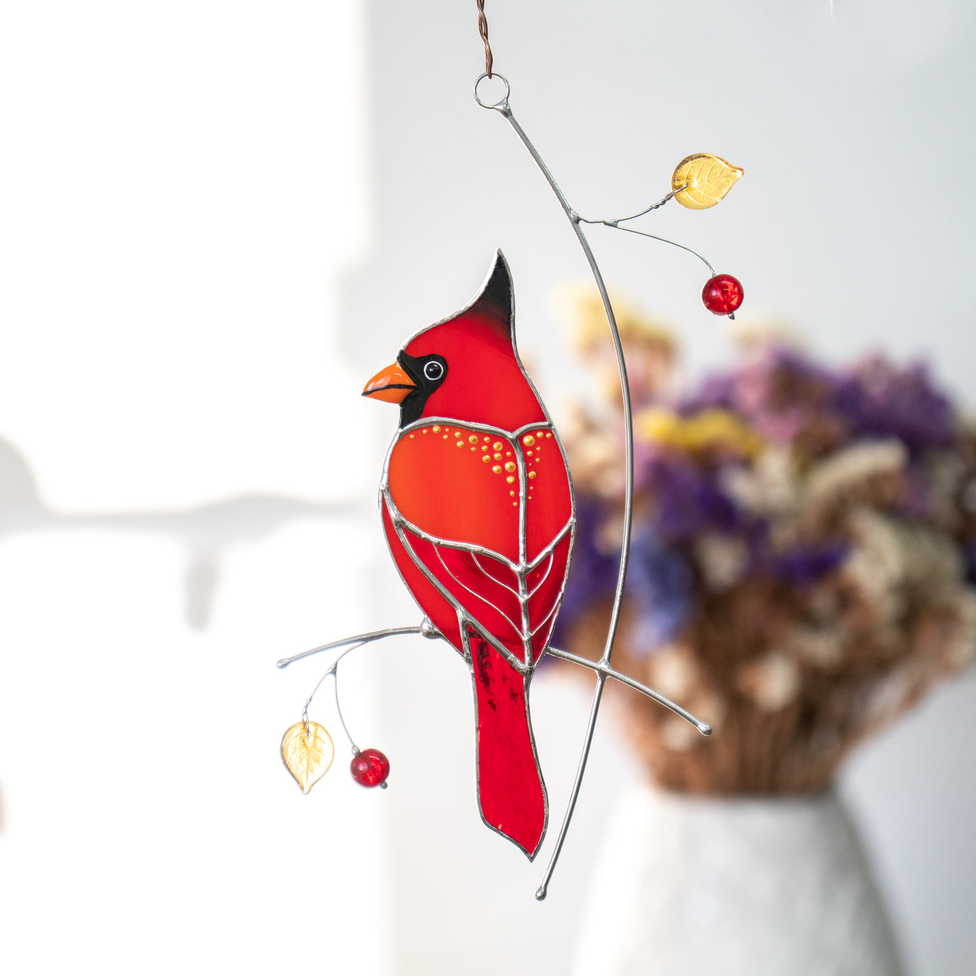 Stained glass red cardinal with golden spots suncatcher