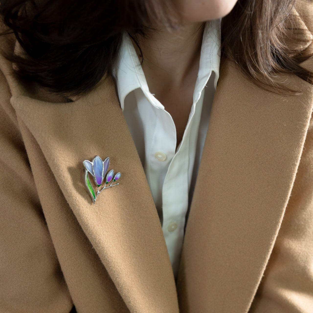 Freesia flower stained glass brooch on a camel coat